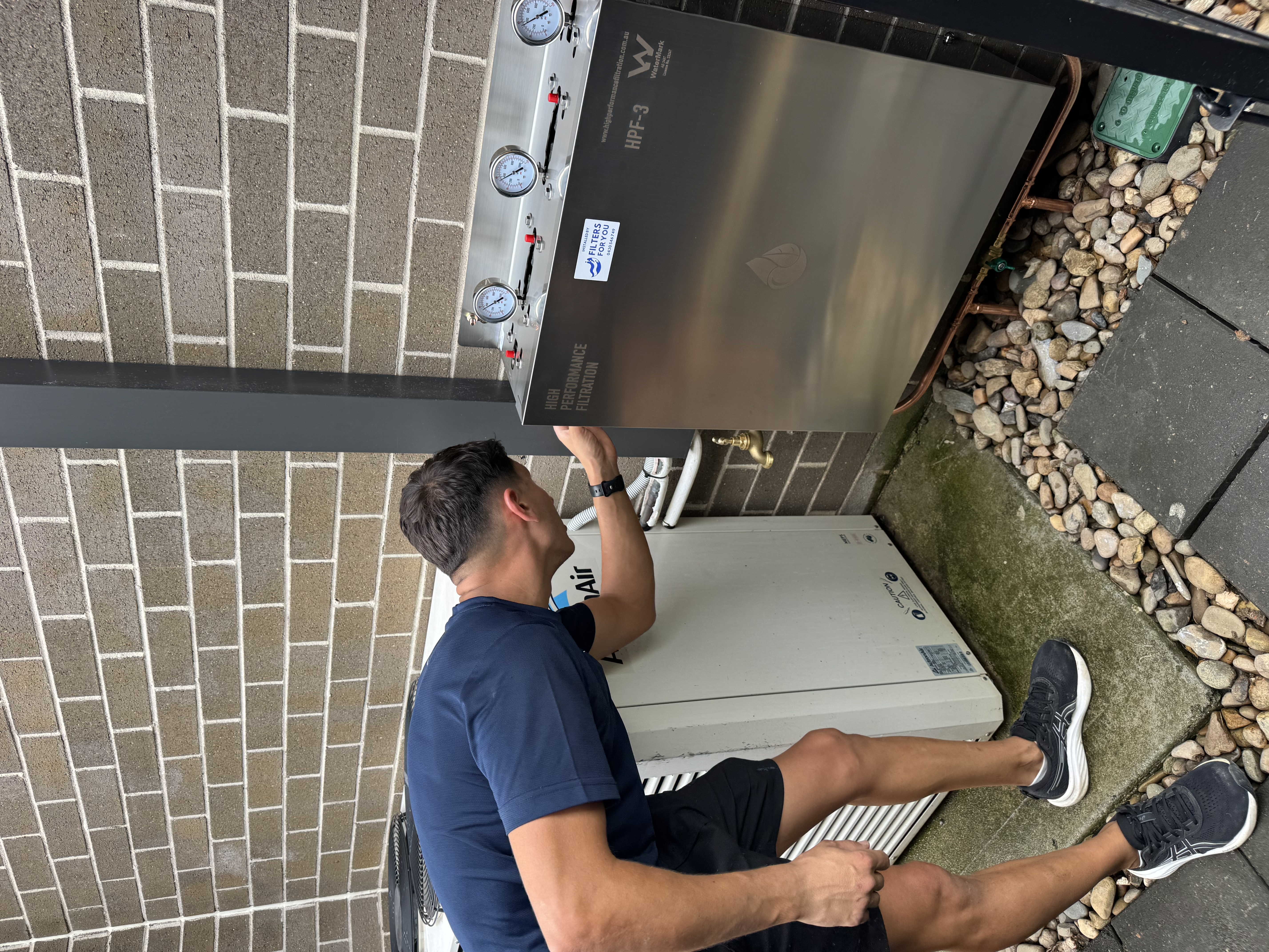 Pure Home HPF-3 whole house water filter installed on external brick wall Sydney