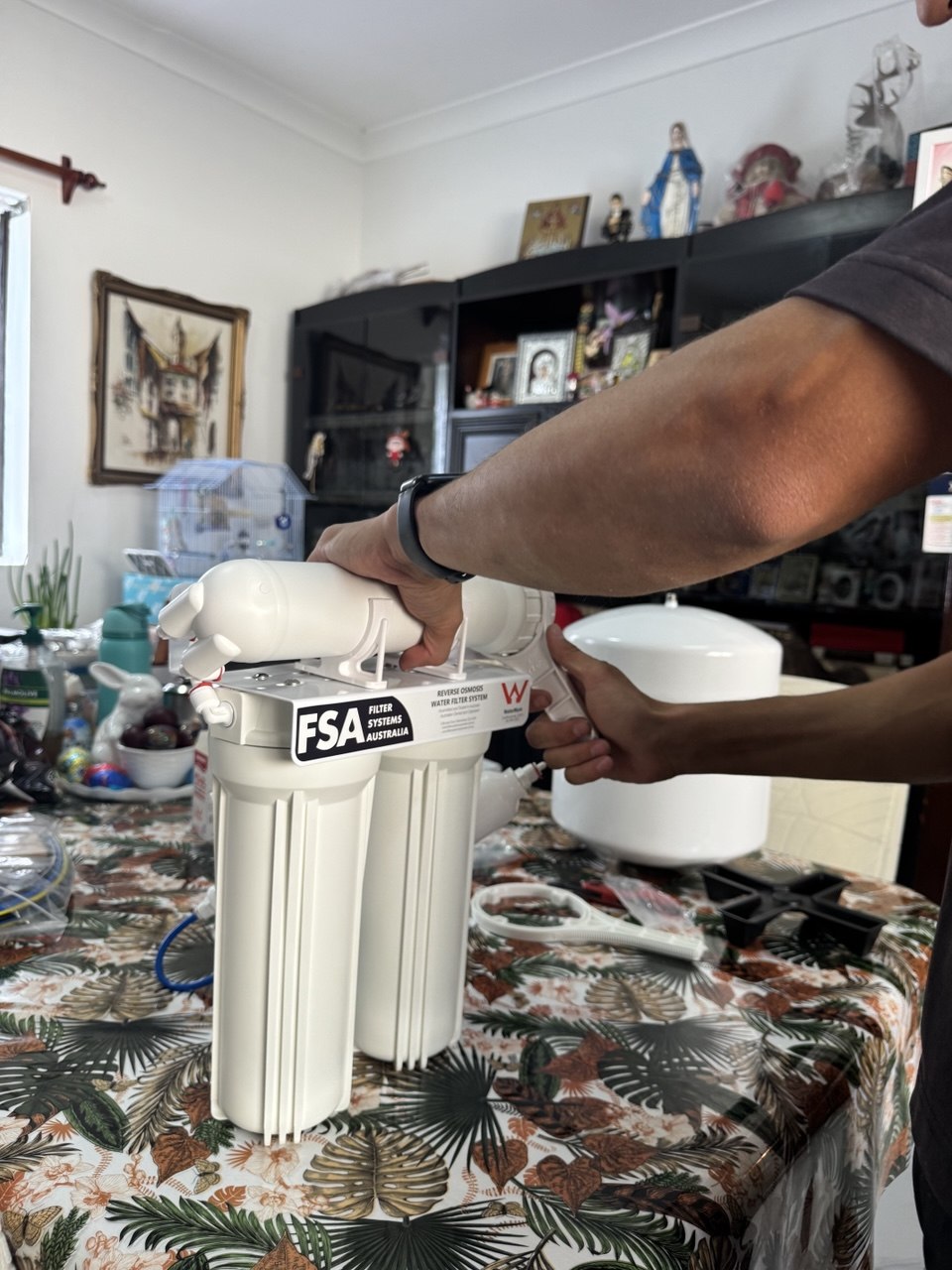 Jean-Paul Barber installing water filter at Sydney home