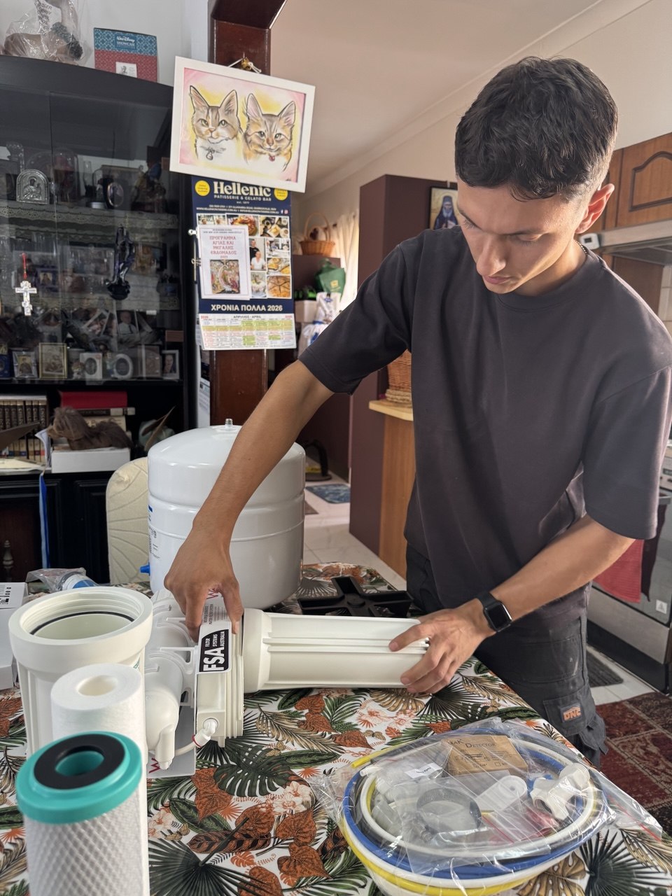 Licensed plumber Jean-Paul Barber at work installing water filter Sydney