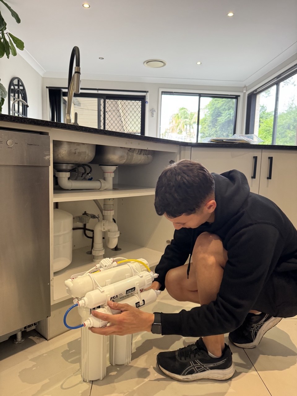 RO filter stages and tank mounted under kitchen sink