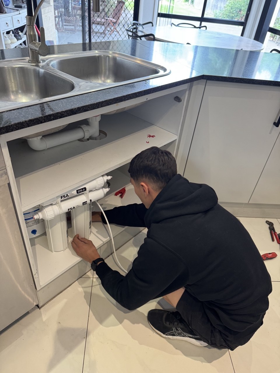 5-stage RO system installed and connected under Sydney kitchen sink