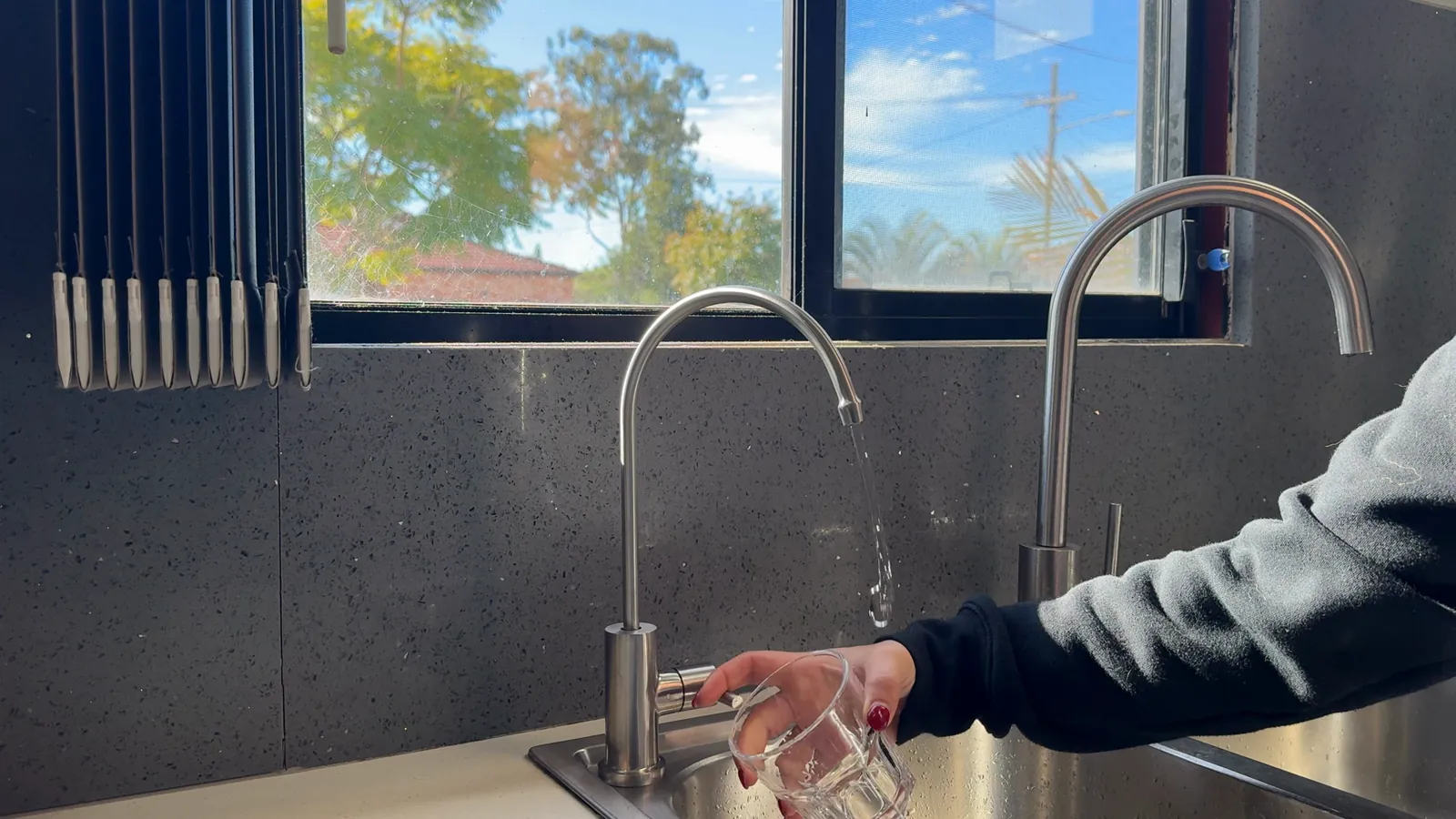 Filtered water flowing from a kitchen mixer